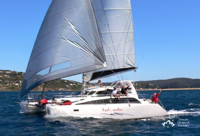 RED UNDIES  38' Lightwave Sailing Catamaran Private New Year's Eve Boat Hire